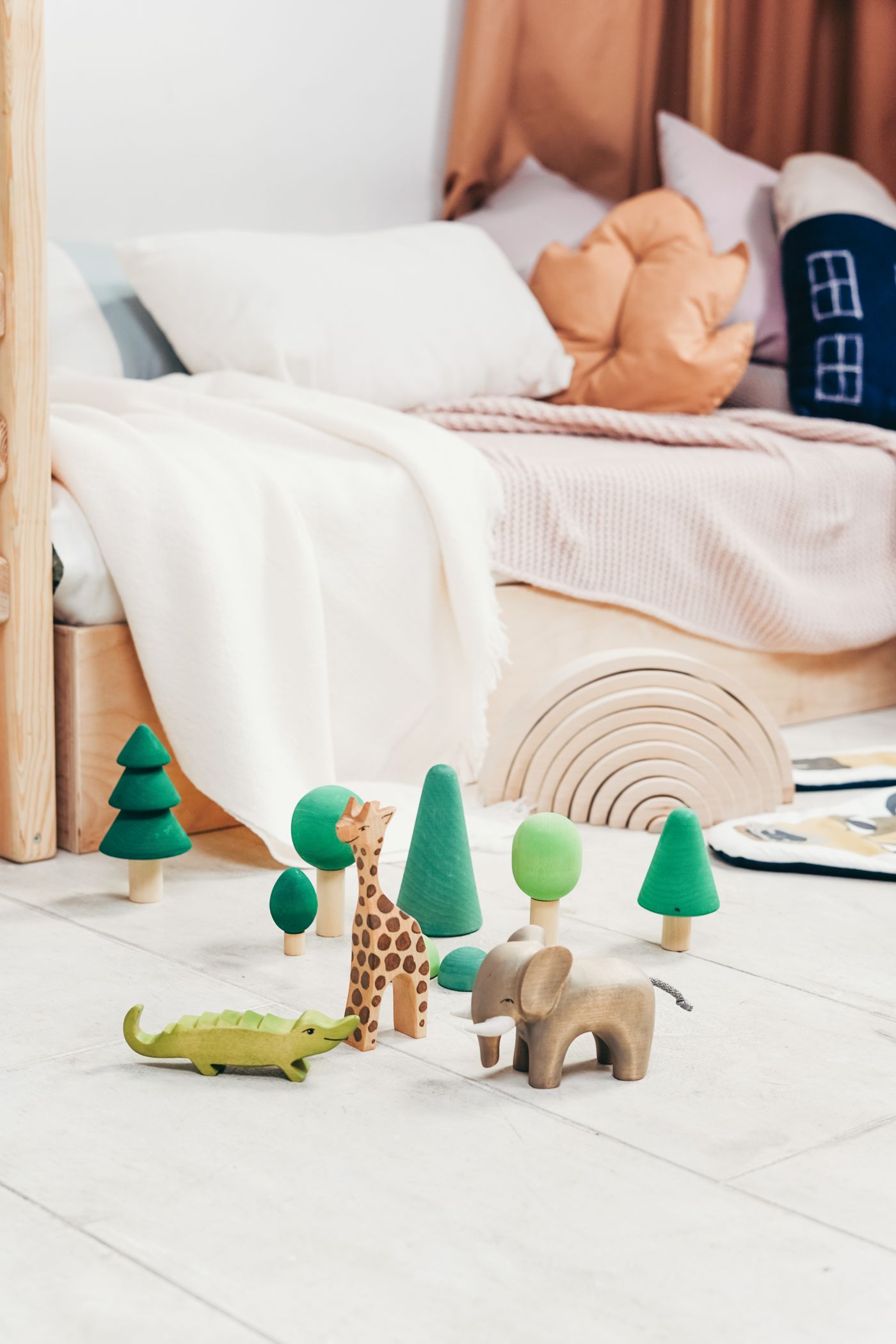 Wooden animal toys in a cozy nature-inspired playroom